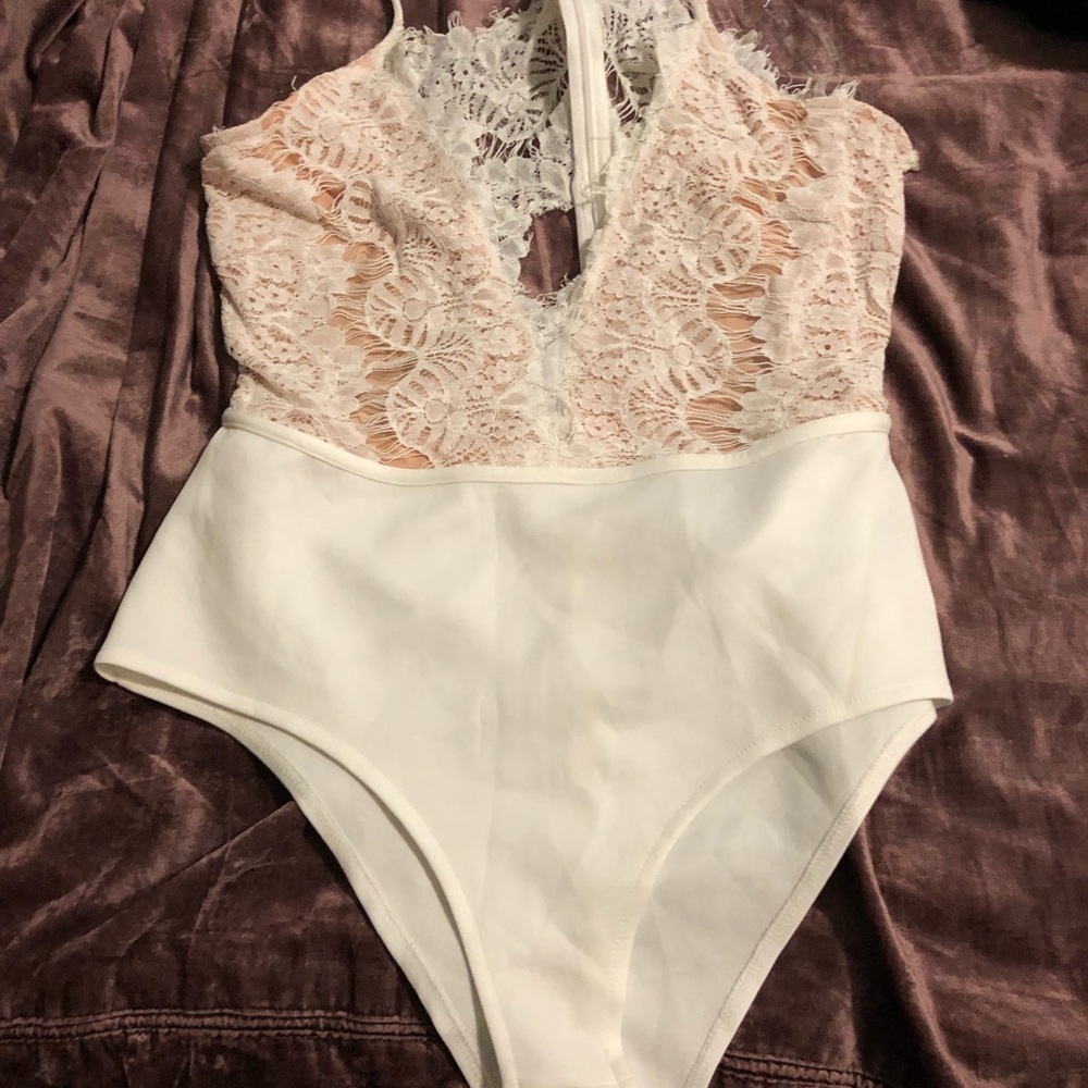 Beautiful lace deep pounce white one piece.